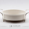 White porcelain plate with silver plated stand