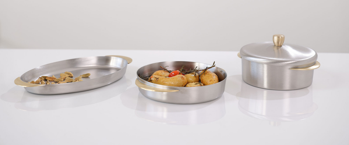 Topkapi- Brushed Stainless steel tableware with brass handles bowls, pots and oval plates